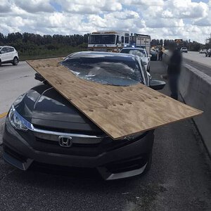 Freeway Plywood Sliced Through Car